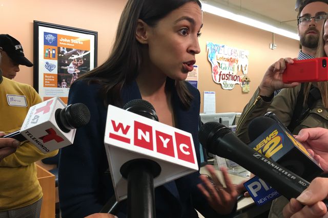 Alexandria Ocasio-Cortez speaks to reporters after her town hall meeting in Queens on Thursday night.